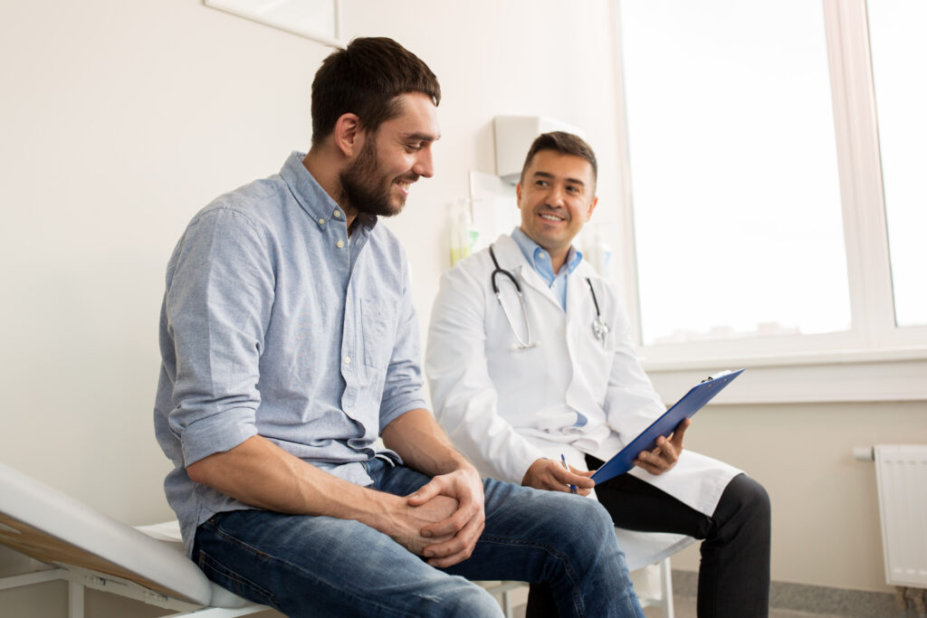 Man talking with his doctor about colonoscopy prep